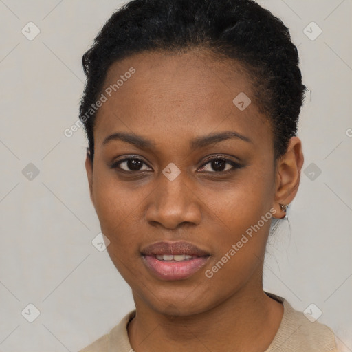 Joyful black young-adult female with short  black hair and brown eyes