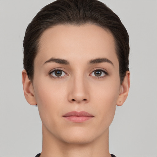 Neutral white young-adult female with short  brown hair and brown eyes