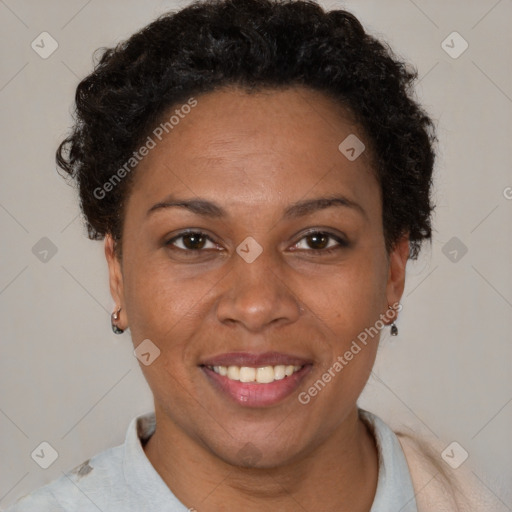 Joyful black adult female with short  brown hair and brown eyes