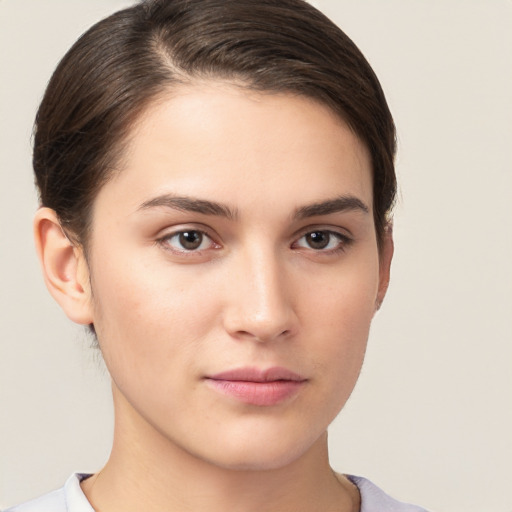 Neutral white young-adult female with short  brown hair and brown eyes