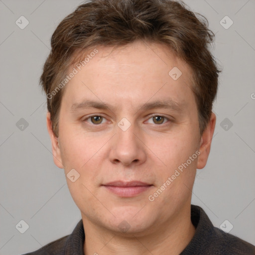 Joyful white adult male with short  brown hair and grey eyes