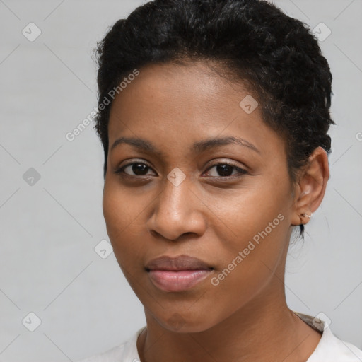 Joyful black young-adult female with short  brown hair and brown eyes