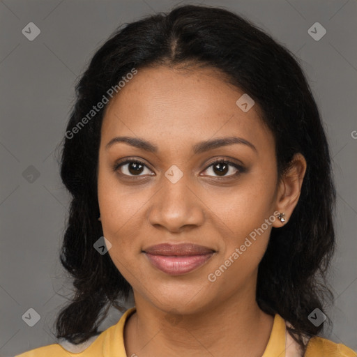 Joyful black young-adult female with long  black hair and brown eyes