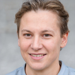 Joyful white adult female with short  brown hair and grey eyes