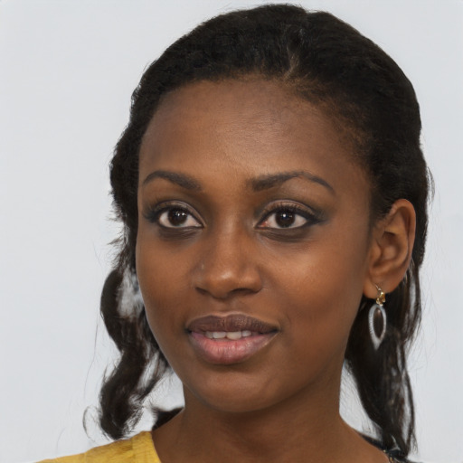 Joyful black young-adult female with medium  black hair and brown eyes