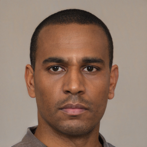 Neutral latino young-adult male with short  brown hair and brown eyes