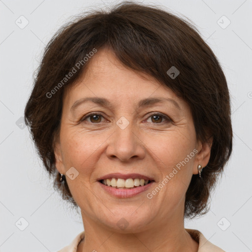 Joyful white adult female with medium  brown hair and brown eyes