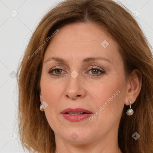 Joyful white adult female with long  brown hair and brown eyes