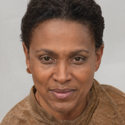 Joyful white adult female with short  brown hair and brown eyes
