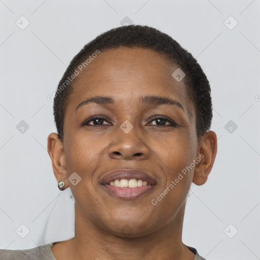 Joyful black young-adult female with short  brown hair and brown eyes