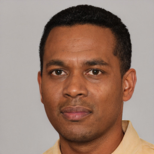 Neutral black young-adult male with short  black hair and brown eyes