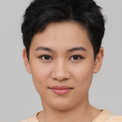 Joyful asian young-adult female with short  black hair and brown eyes