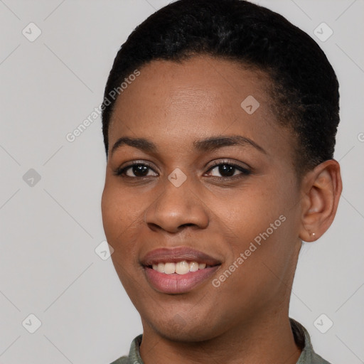 Joyful black young-adult female with short  black hair and brown eyes