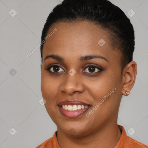 Joyful black young-adult female with short  brown hair and brown eyes