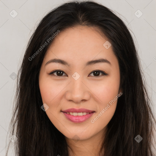 Joyful asian young-adult female with long  brown hair and brown eyes