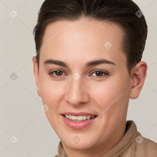 Joyful white young-adult female with short  brown hair and brown eyes