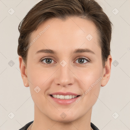 Joyful white young-adult female with short  brown hair and grey eyes