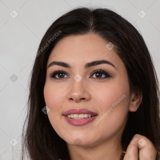 Joyful white young-adult female with long  brown hair and brown eyes