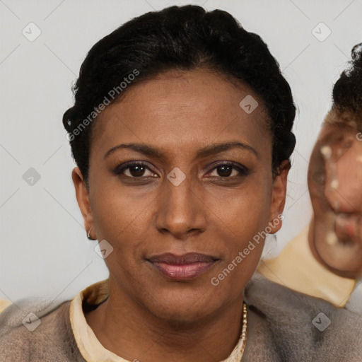 Joyful latino young-adult female with short  brown hair and brown eyes