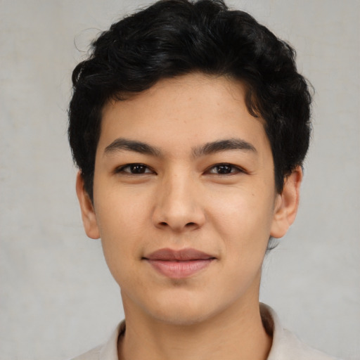 Joyful asian young-adult male with short  black hair and brown eyes
