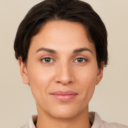 Joyful white young-adult female with short  brown hair and brown eyes