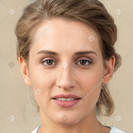 Joyful white young-adult female with medium  brown hair and grey eyes