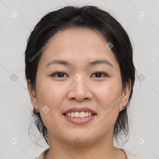 Joyful asian young-adult female with medium  brown hair and brown eyes