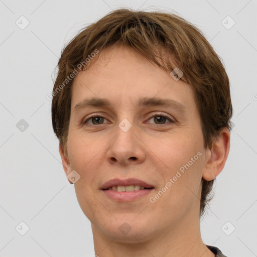 Joyful white young-adult female with short  brown hair and grey eyes