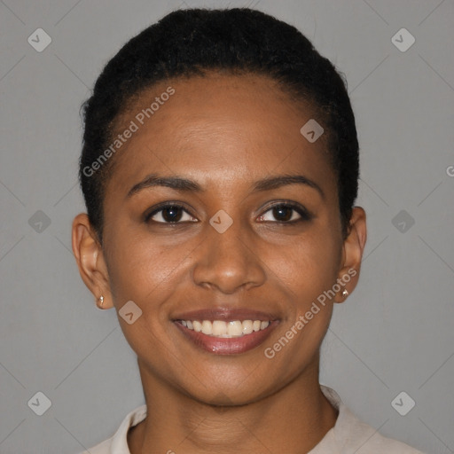 Joyful black young-adult female with short  brown hair and brown eyes