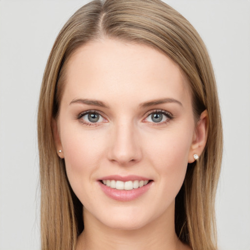 Joyful white young-adult female with long  brown hair and grey eyes