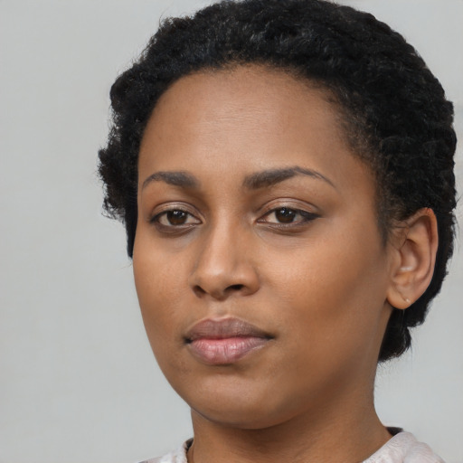 Neutral black young-adult female with short  black hair and brown eyes