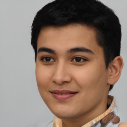 Joyful latino young-adult male with short  black hair and brown eyes