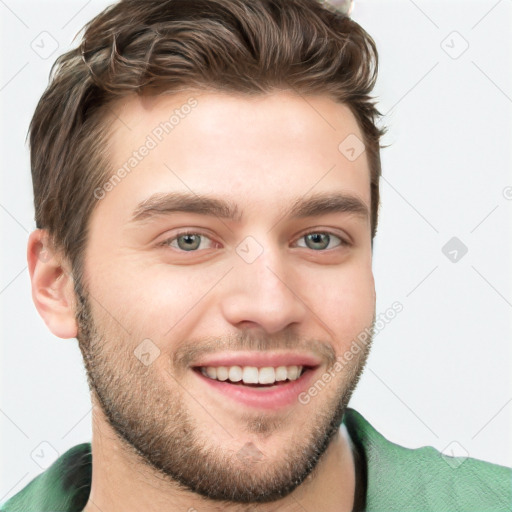 Joyful white young-adult male with short  brown hair and blue eyes