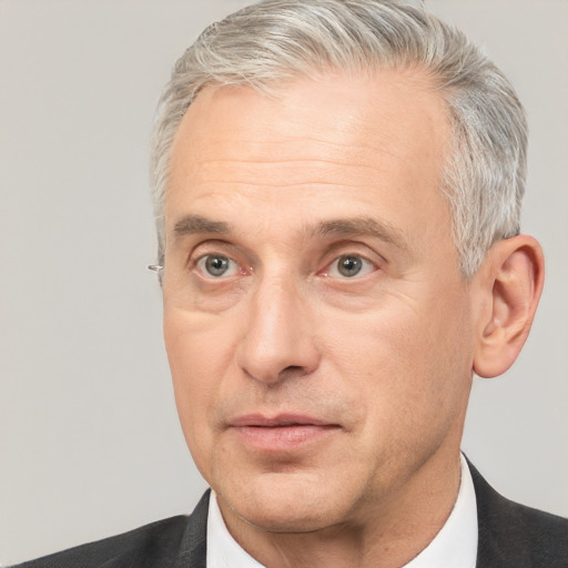 Neutral white middle-aged male with short  gray hair and brown eyes