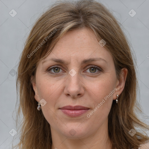 Joyful white adult female with long  brown hair and grey eyes