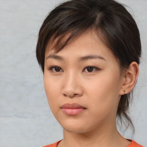 Neutral asian young-adult female with medium  brown hair and brown eyes
