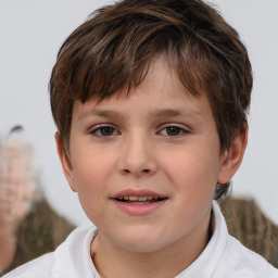 Joyful white child male with short  brown hair and brown eyes