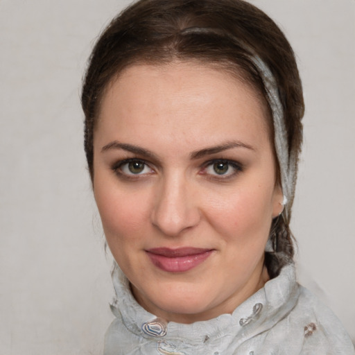 Joyful white young-adult female with medium  brown hair and blue eyes