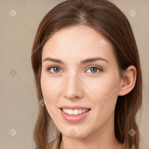 Joyful white young-adult female with long  brown hair and grey eyes