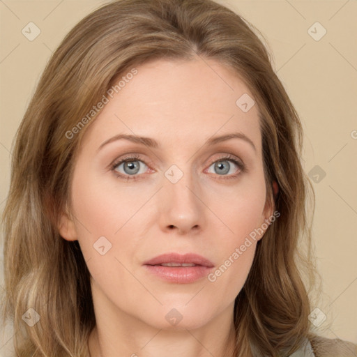 Joyful white young-adult female with long  brown hair and green eyes