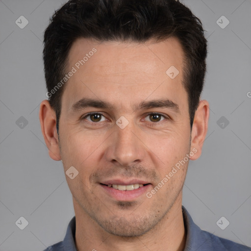 Joyful white adult male with short  brown hair and brown eyes