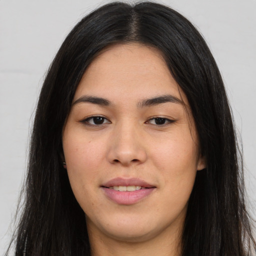 Joyful asian young-adult female with long  black hair and brown eyes