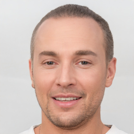 Joyful white adult male with short  brown hair and brown eyes