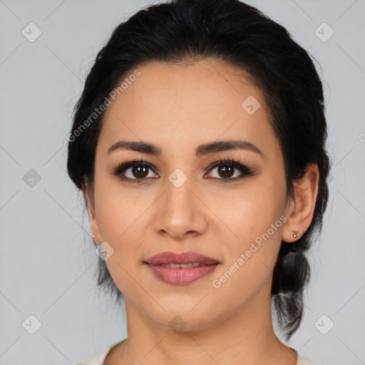 Joyful latino young-adult female with medium  black hair and brown eyes