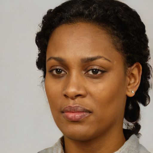 Neutral black young-adult female with medium  black hair and brown eyes