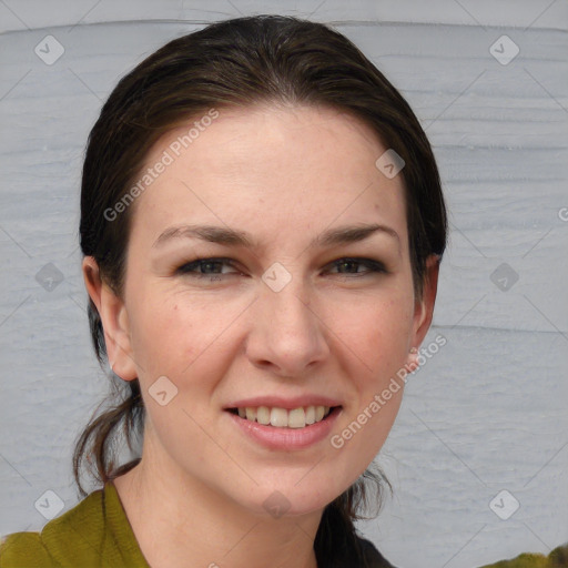 Joyful white young-adult female with medium  brown hair and grey eyes