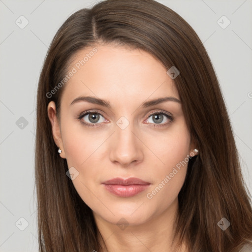 Neutral white young-adult female with long  brown hair and brown eyes