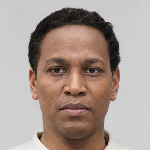 Neutral black adult male with short  black hair and brown eyes