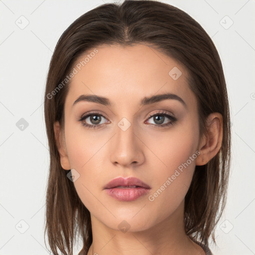 Neutral white young-adult female with long  brown hair and brown eyes