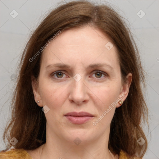 Joyful white adult female with medium  brown hair and grey eyes